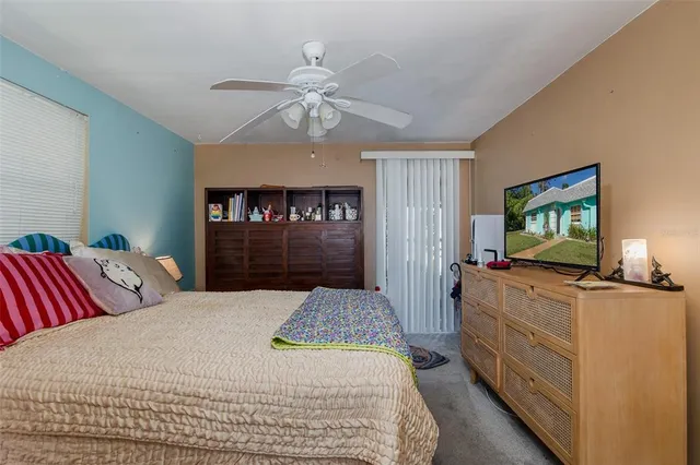 a bedroom with a bed and dresser