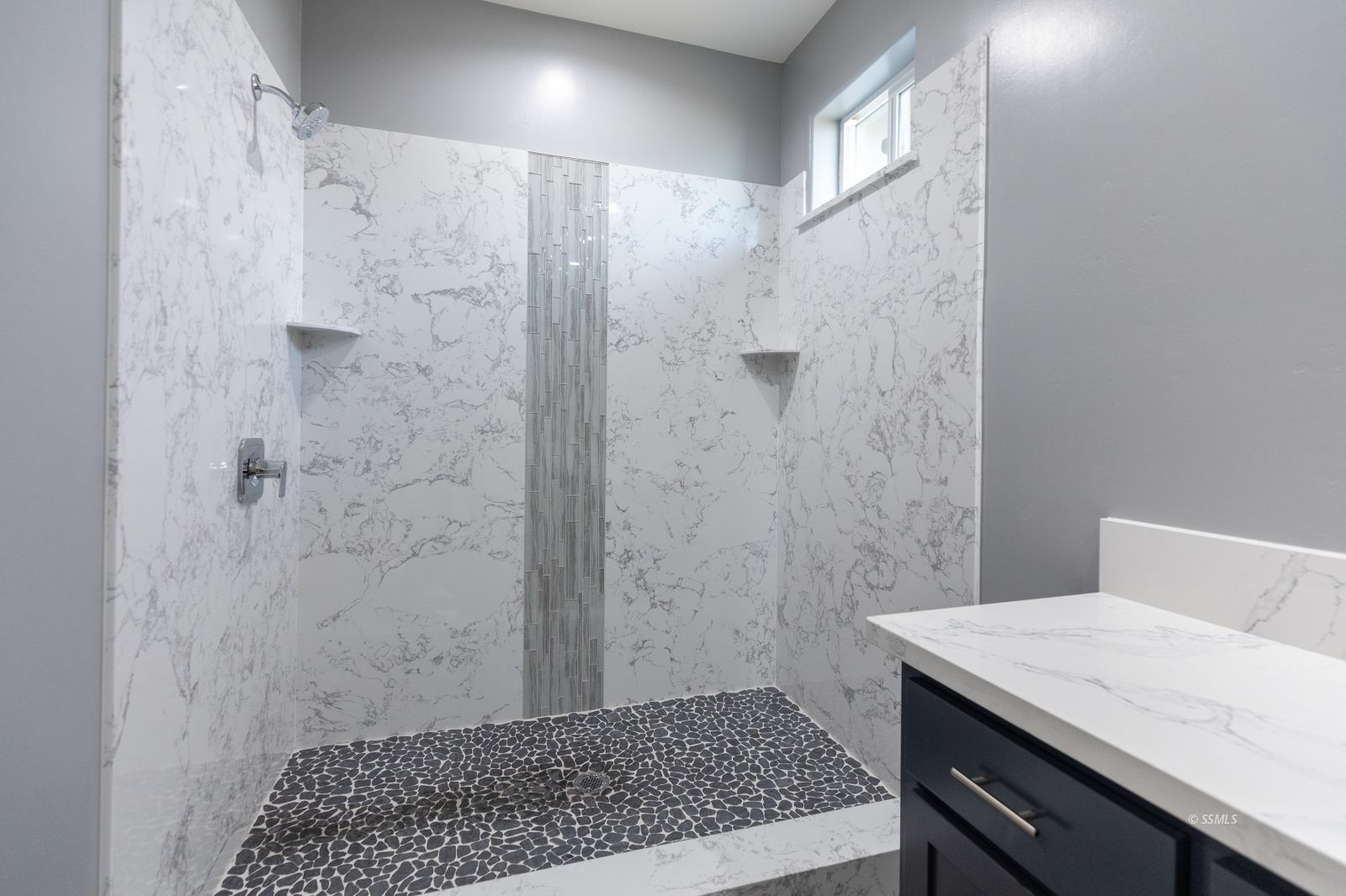 424 Thomas Street Ridgecrest, CA 93555 - Photo 20 of 30 a bathroom with a granite countertop shower a sink and a toilet