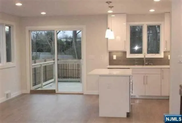 a bathroom with a double vanity sink and mirror