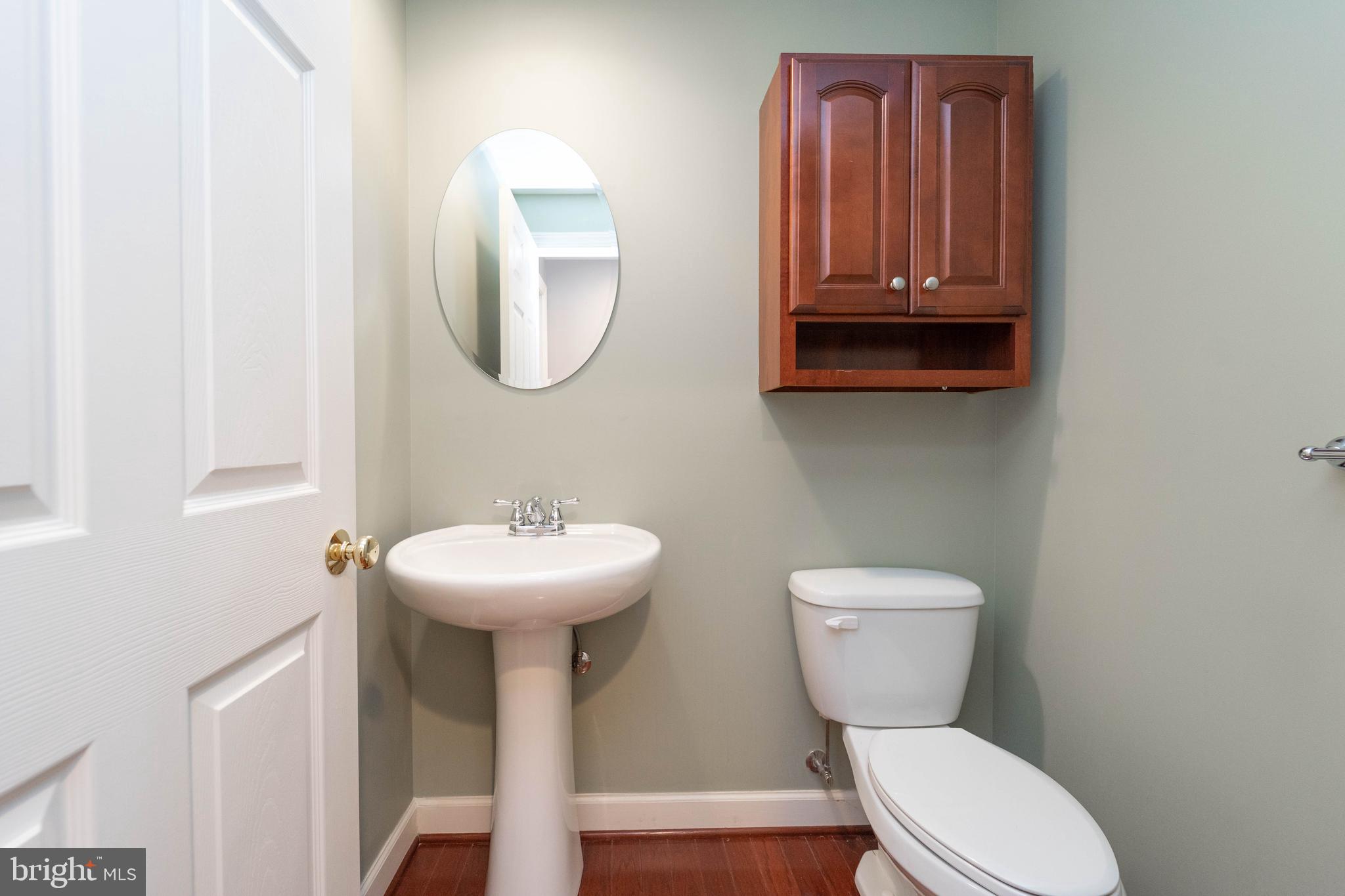 321 Bulwark Alley Annapolis, MD 21401 - Photo 17 of 58 a bathroom with a toilet sink and mirror