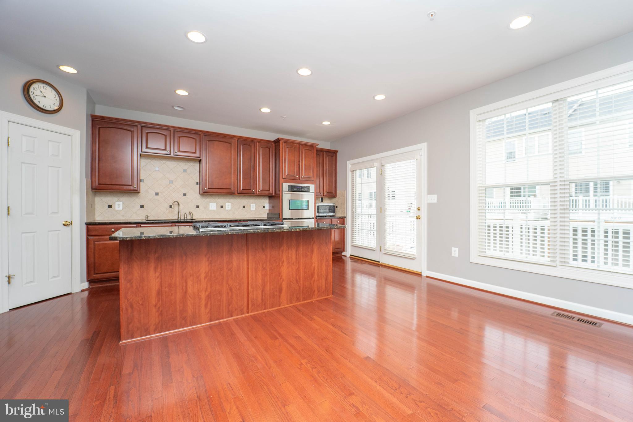 321 Bulwark Alley Annapolis, MD 21401 - Photo 24 of 58 a kitchen with stainless steel appliances granite countertop a refrigerator a sink dishwasher and a large oven