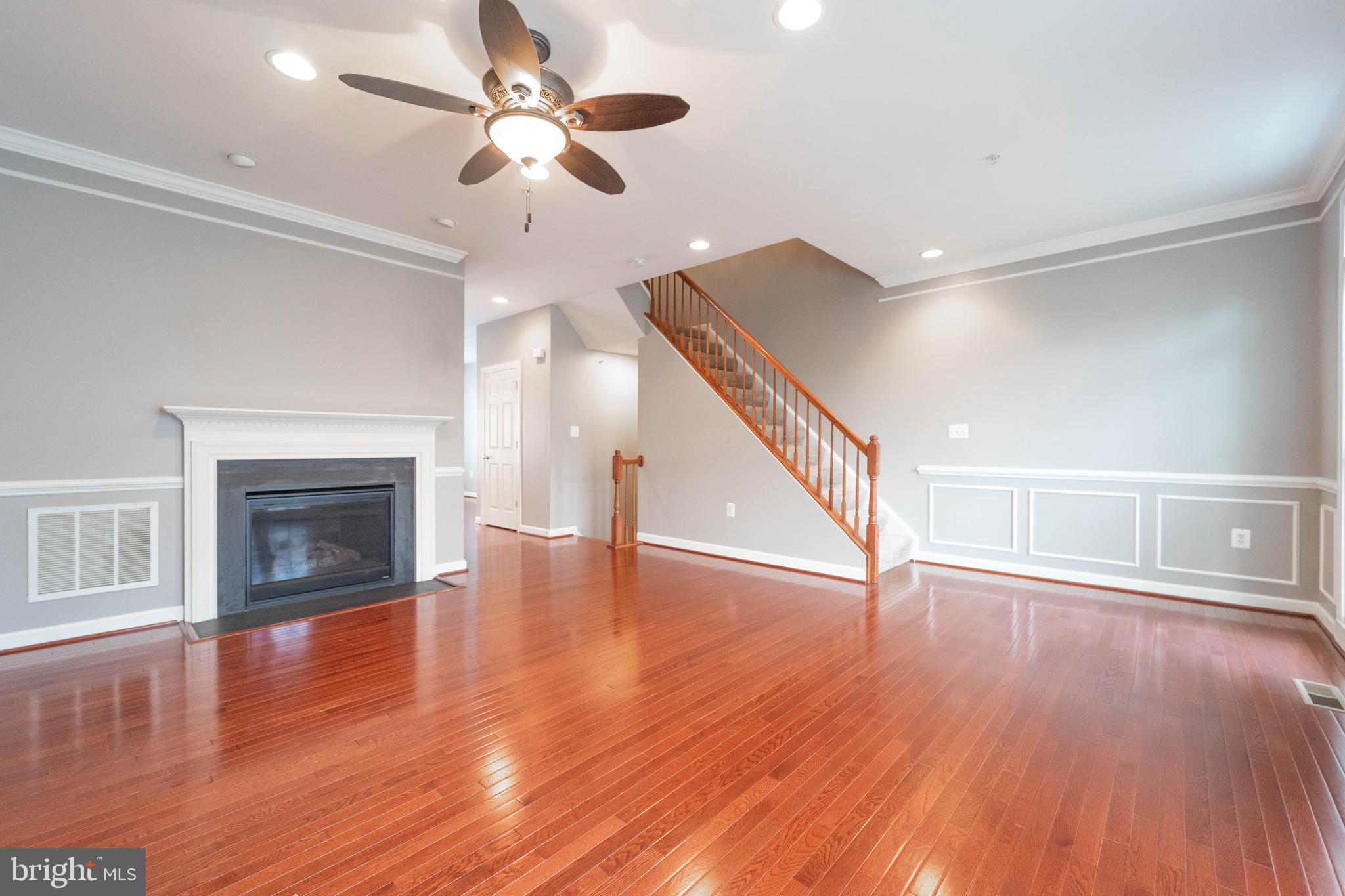 321 Bulwark Alley Annapolis, MD 21401 - Photo 4 of 58 a view of an empty room with wooden floor fireplace and a window
