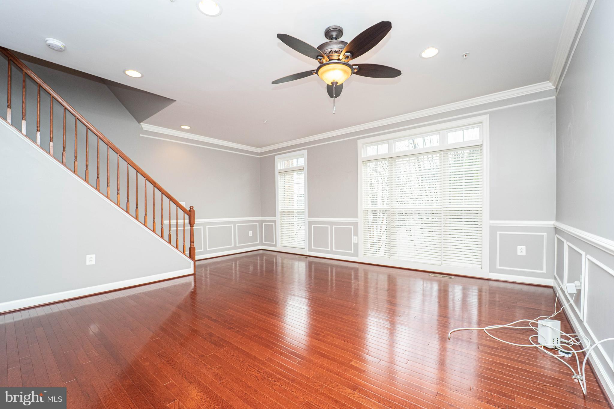 321 Bulwark Alley Annapolis, MD 21401 - Photo 6 of 58 a view of an empty room with wooden floor and a window
