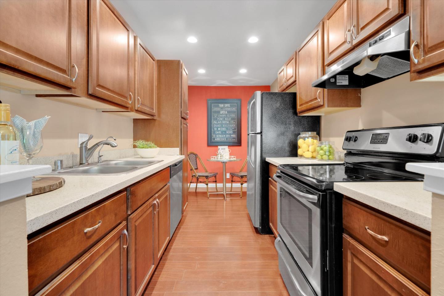 1025 Shell Boulevard, Unit 9 Foster City, CA 94404 - Photo 11 of 31 a kitchen with stainless steel appliances granite countertop a sink a stove and a refrigerator