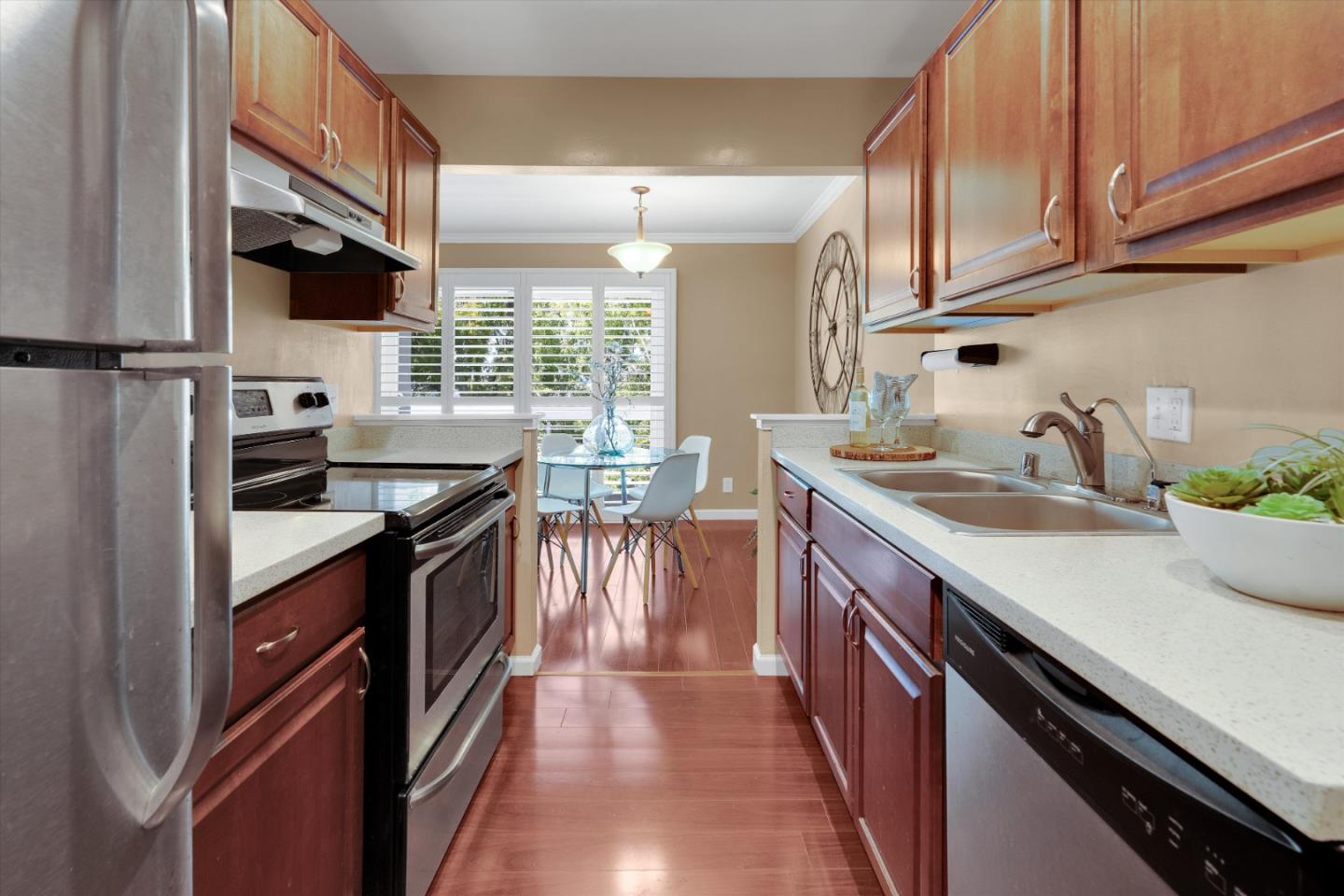 1025 Shell Boulevard, Unit 9 Foster City, CA 94404 - Photo 12 of 31 a kitchen with stainless steel appliances a sink stove and cabinets
