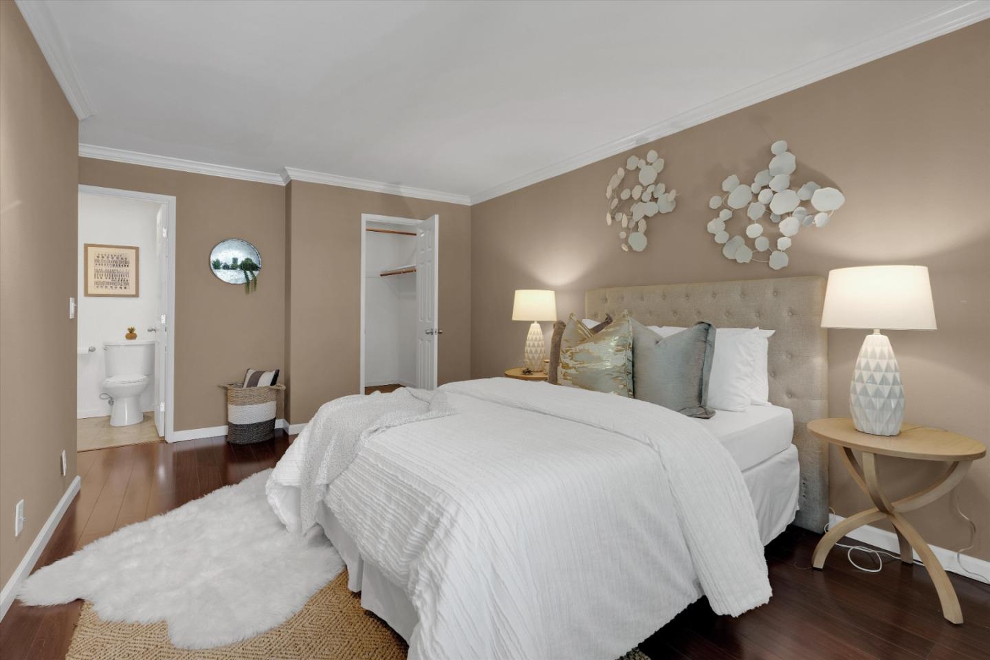 1025 Shell Boulevard, Unit 9 Foster City, CA 94404 - Photo 16 of 31 a bedroom with a bed and a chandelier