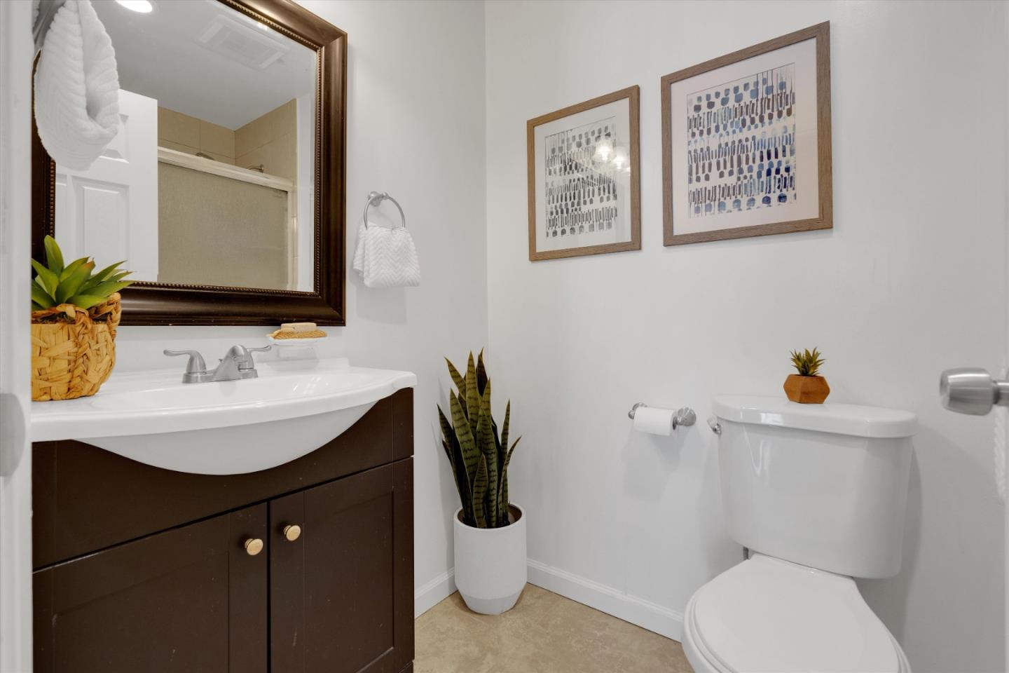 1025 Shell Boulevard, Unit 9 Foster City, CA 94404 - Photo 17 of 31 a bathroom with a sink a toilet and mirror