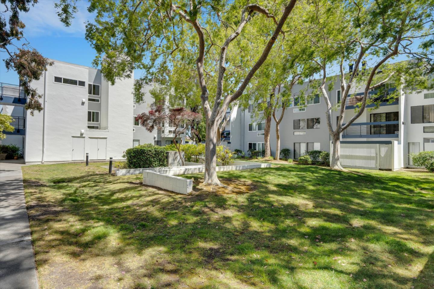 1025 Shell Boulevard, Unit 9 Foster City, CA 94404 - Photo 2 of 31 a view of a house with a yard