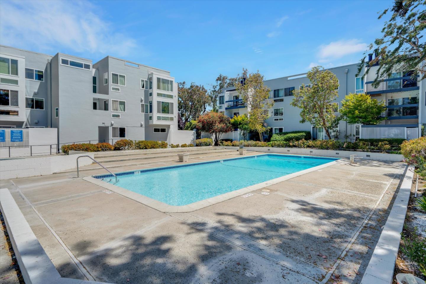 1025 Shell Boulevard, Unit 9 Foster City, CA 94404 - Photo 21 of 31 a swimming pool with outdoor seating and yard