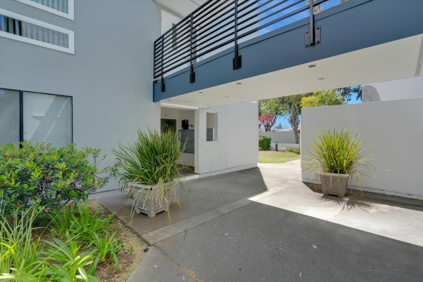 1025 Shell Boulevard, Unit 9 Foster City, CA 94404 - Photo 4 of 31 a potted plant sitting in front of a building