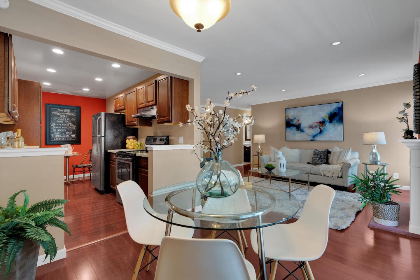1025 Shell Boulevard, Unit 9 Foster City, CA 94404 - Photo 10 of 31 a dining room with furniture a potted plant and kitchen view
