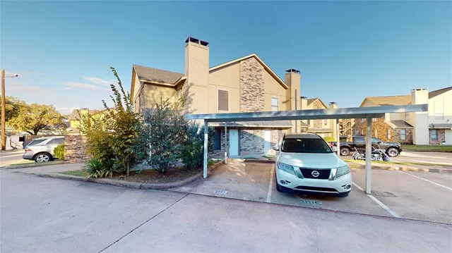 a view of house with outdoor space and sitting area
