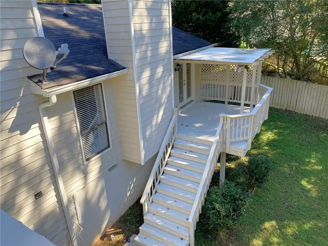 a view of a balcony with wooden floor