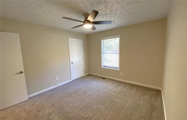 a picture of a tree in front of a house