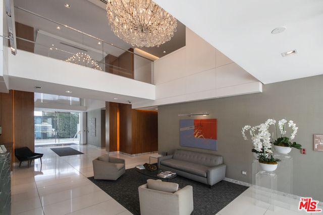 a kitchen with stainless steel appliances granite countertop a sink and a refrigerator