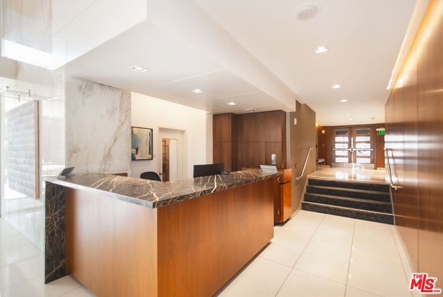 a backyard of a house with yard and outdoor seating