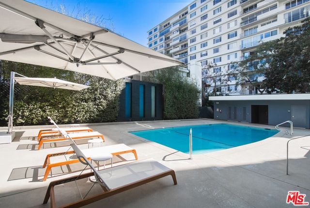a view of a patio with couches and potted plants