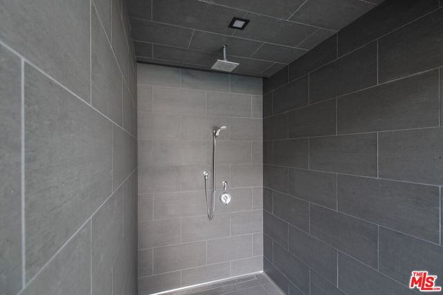 a terrace with outdoor seating and trees