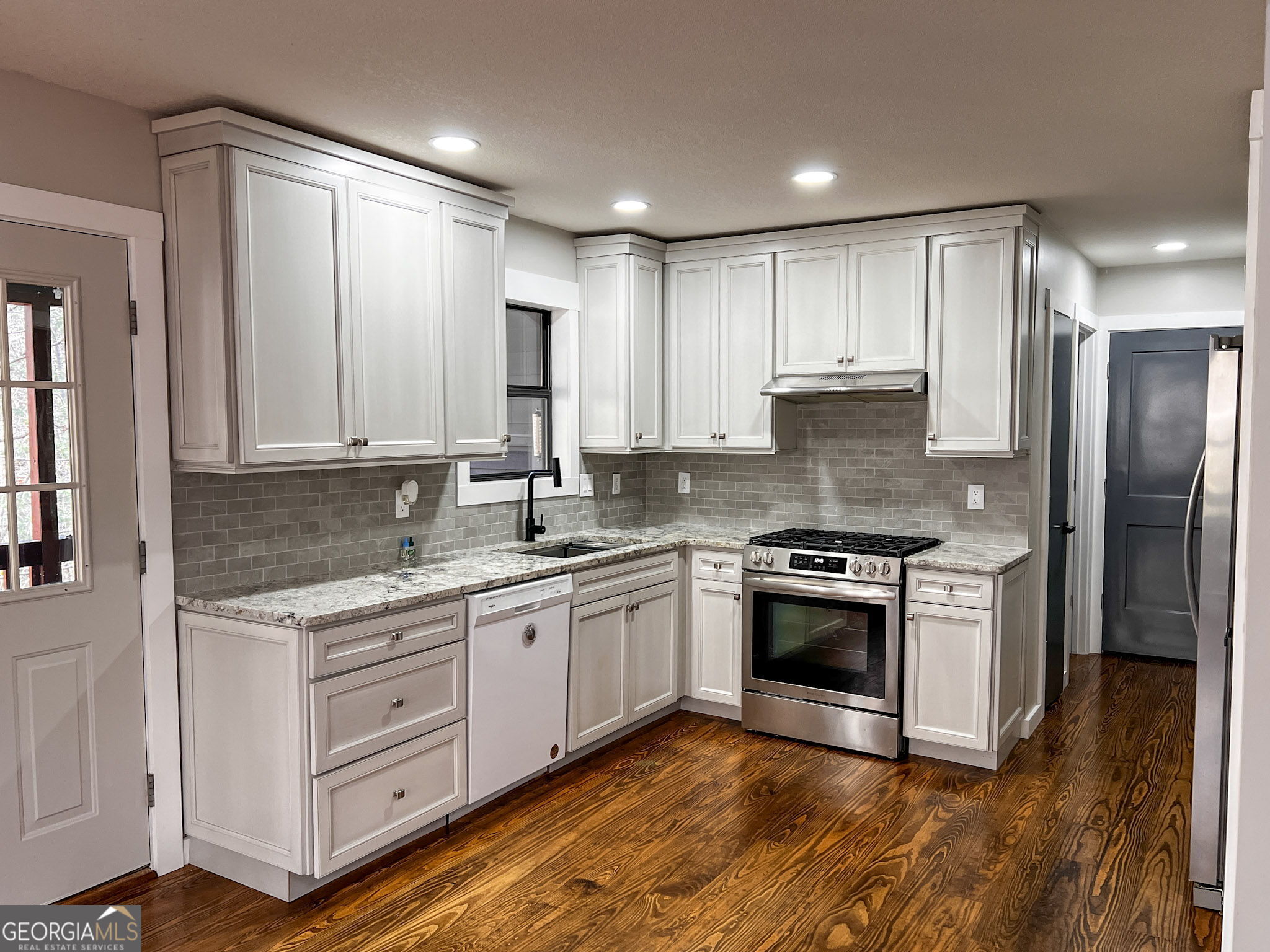 521 Northwind Sautee Nacoochee, GA 30571 - Photo 21 of 66 a kitchen with stainless steel appliances granite countertop a stove a sink and a refrigerator