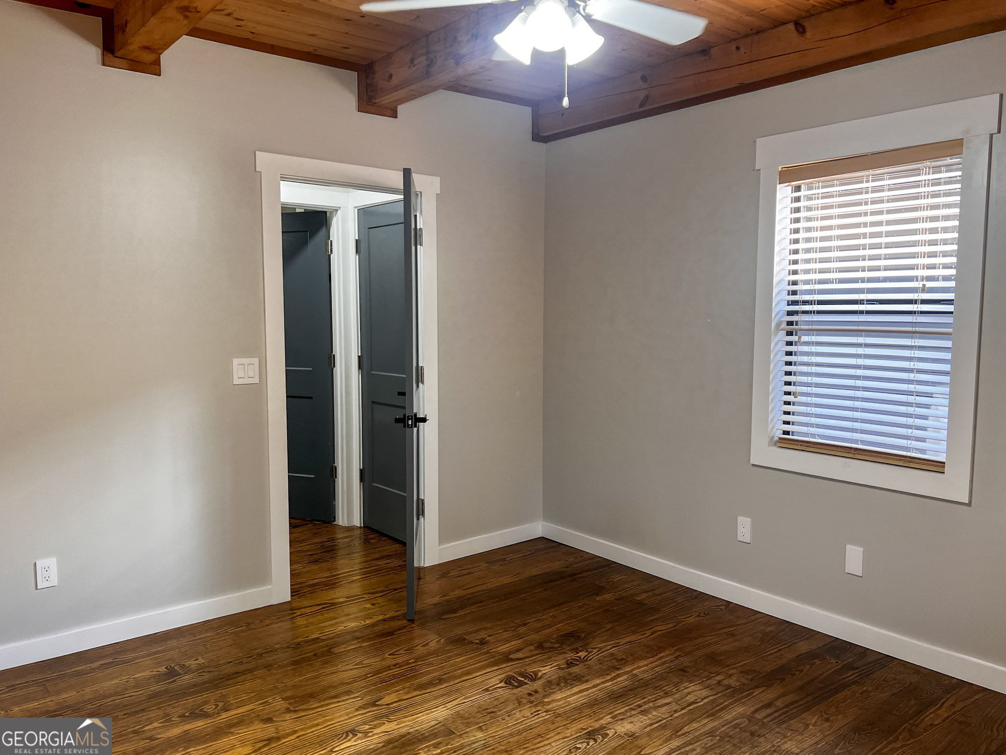 521 Northwind Sautee Nacoochee, GA 30571 - Photo 24 of 66 a view of an empty room with wooden floor and a chandelier