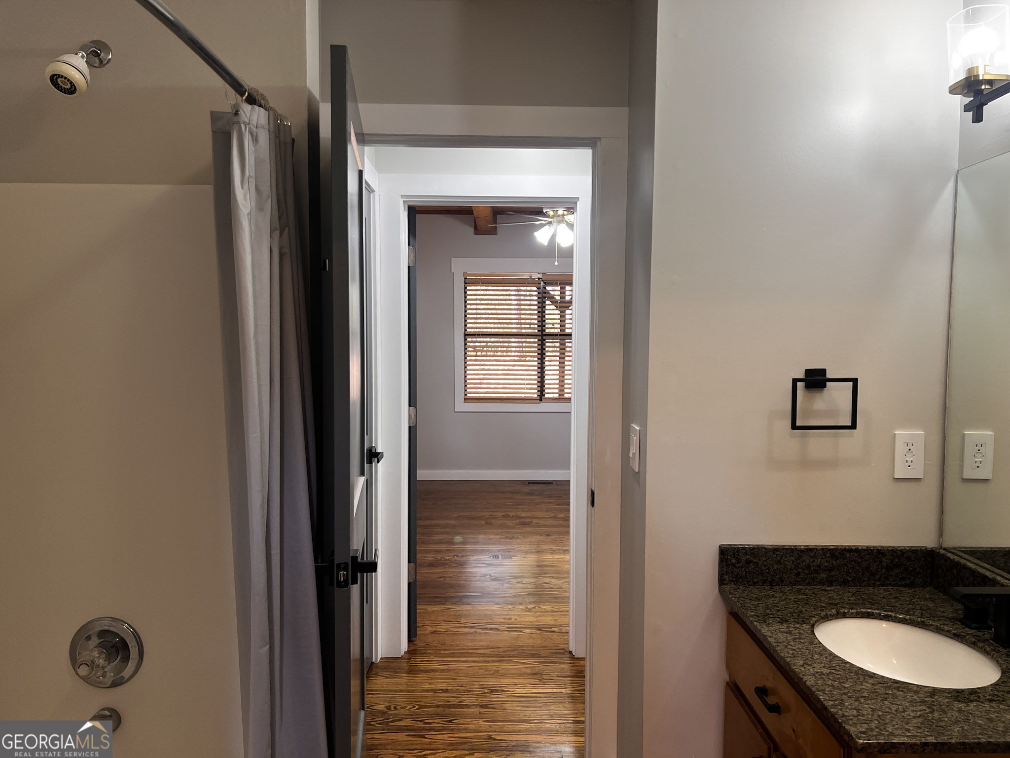 521 Northwind Sautee Nacoochee, GA 30571 - Photo 31 of 66 a bathroom with a granite countertop sink and a mirror