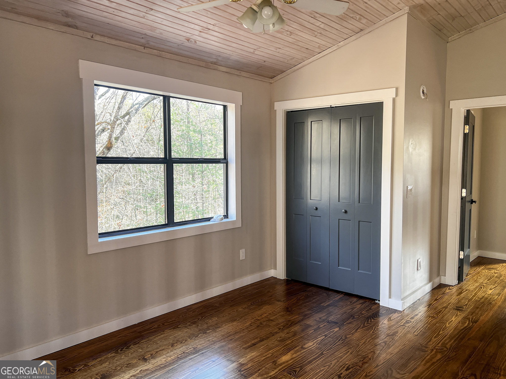 521 Northwind Sautee Nacoochee, GA 30571 - Photo 37 of 66 a view of an empty room with wooden floor and a window