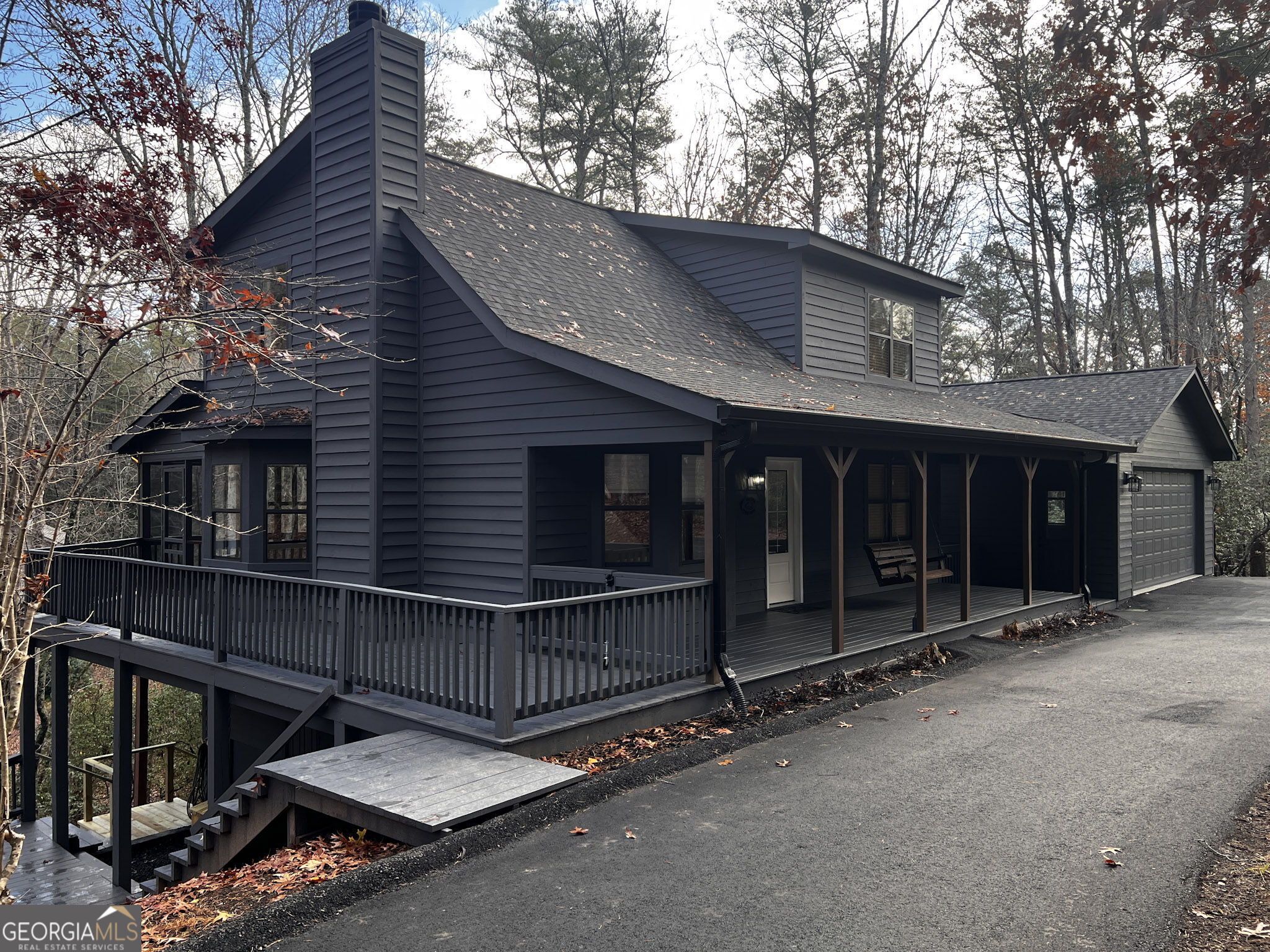 521 Northwind Sautee Nacoochee, GA 30571 - Photo 59 of 66 a view of a house with a large window and wooden fence