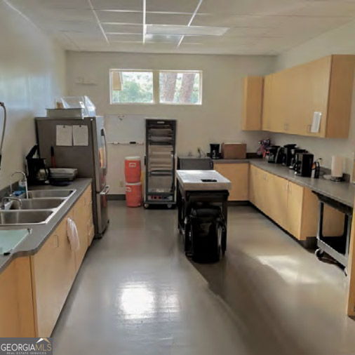 521 Northwind Sautee Nacoochee, GA 30571 - Photo 74 of 81 a kitchen with stainless steel appliances a stove sink and cabinets