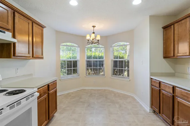 a kitchen that has a stove and a sink