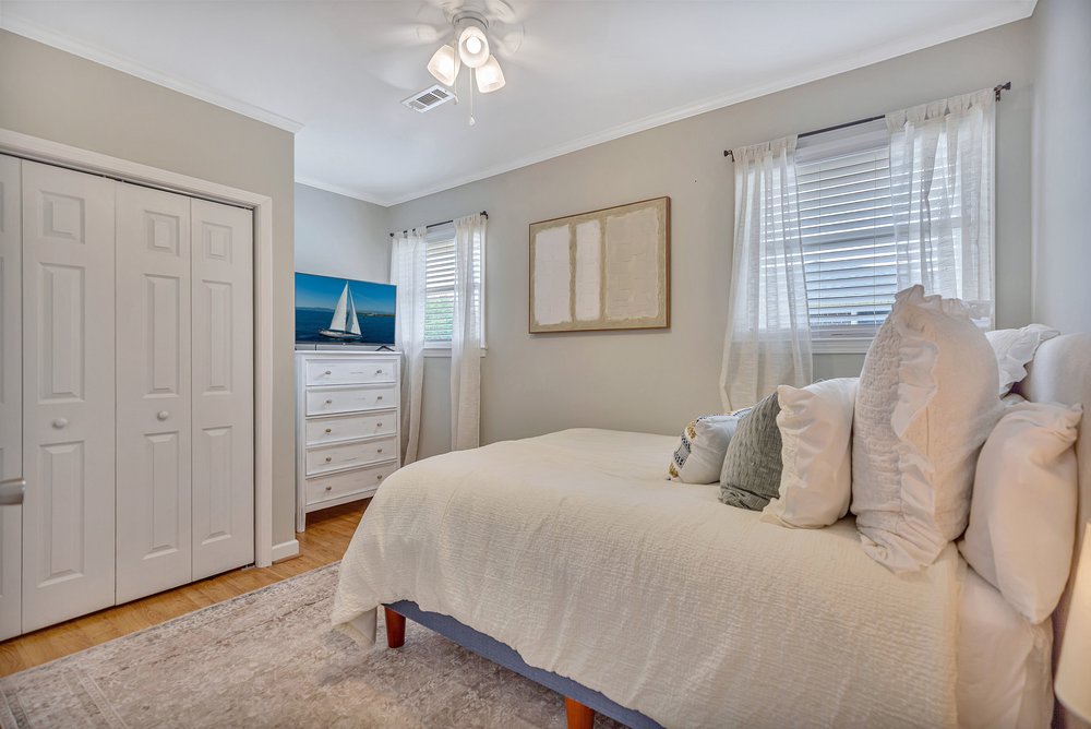 2310 Hannah Road Anderson, SC 29621 - Photo 25 of 32 A cozy bedroom with a harmonious blend of neutral tones and wood flooring offers comfort and functionality.