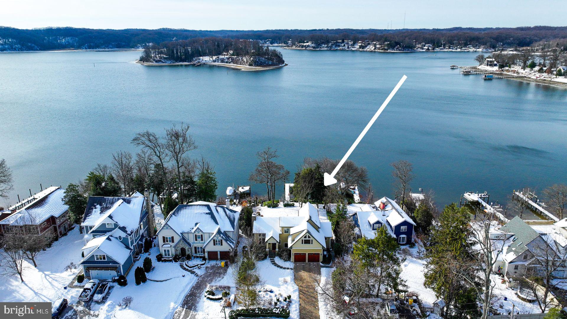 a view of a house with outdoor space and lake view