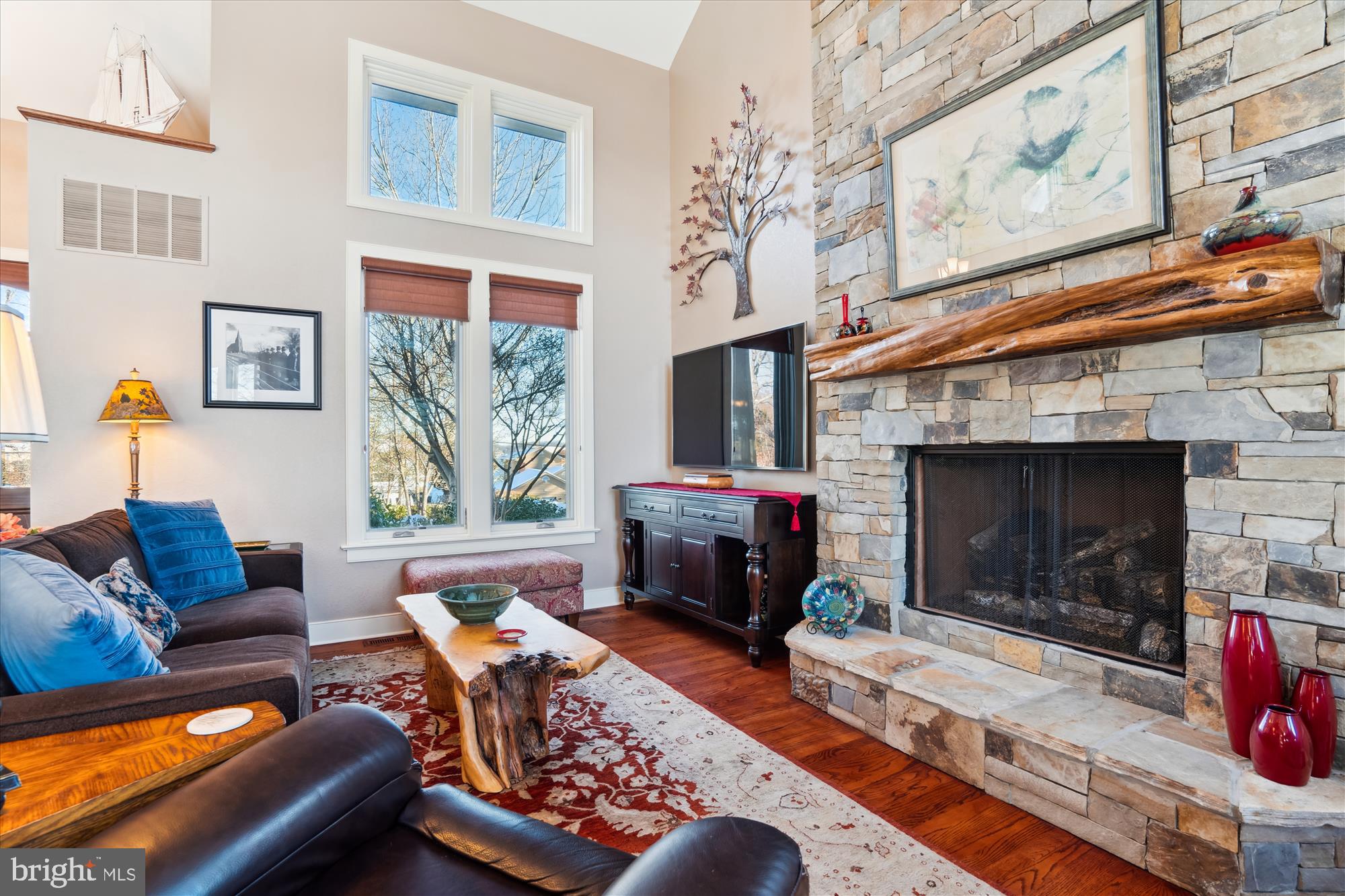 255 Long Point Road Crownsville, MD 21032 - Photo 26 of 67 a living room with furniture a large window and a fireplace