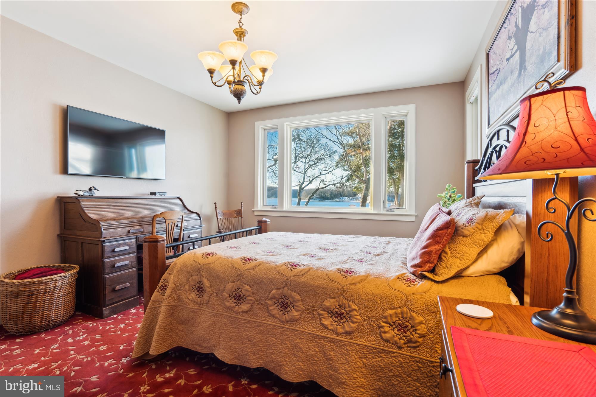 255 Long Point Road Crownsville, MD 21032 - Photo 32 of 67 a bedroom with a bed and a flat tv screen on dresser