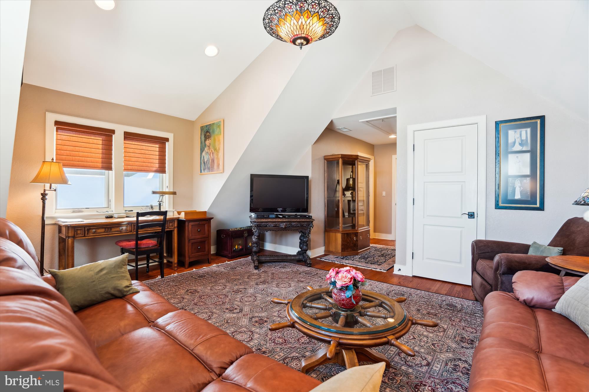 255 Long Point Road Crownsville, MD 21032 - Photo 48 of 67 a living room with furniture and a flat screen tv with wooden floor