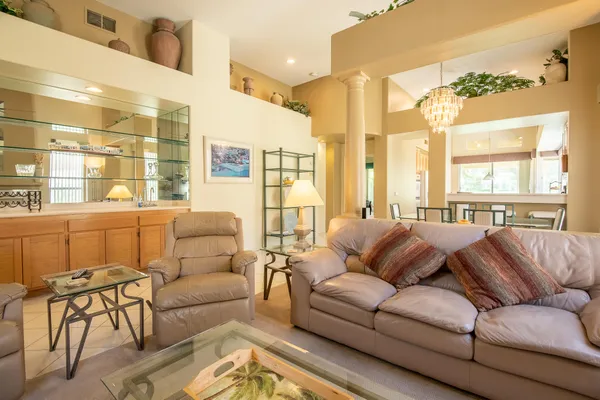 a living room with furniture and a large window