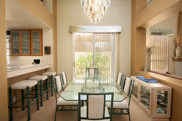 a view of a dining room with furniture window and outside view