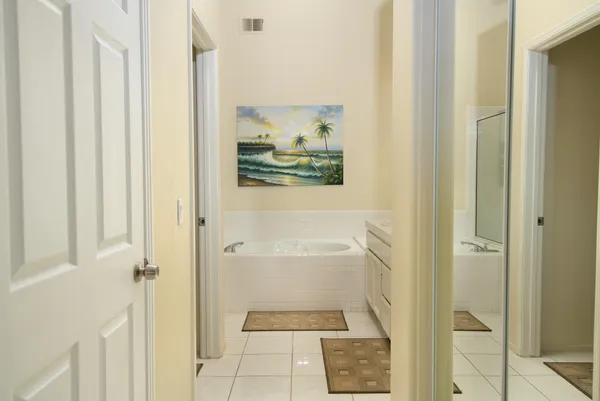 a bathroom with a tub and shower