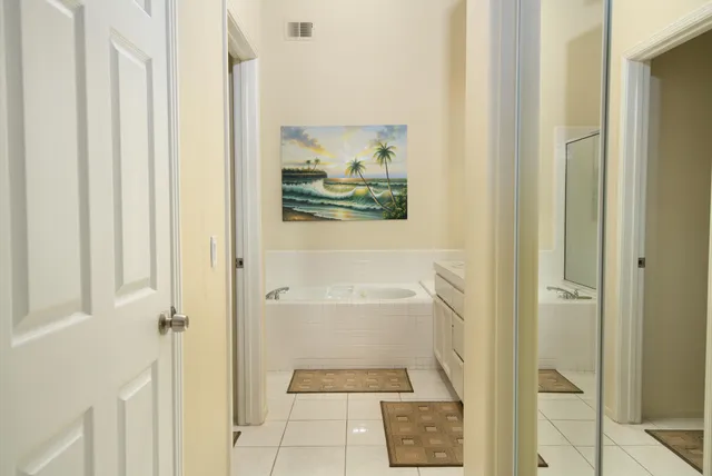a bathroom with a tub and shower