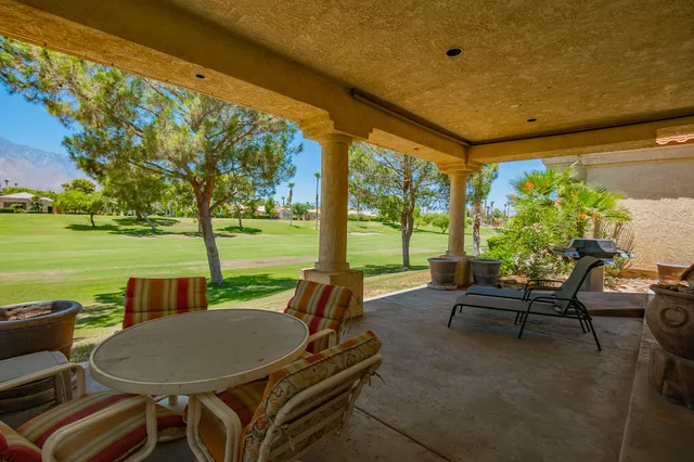 a view of a patio with swimming pool