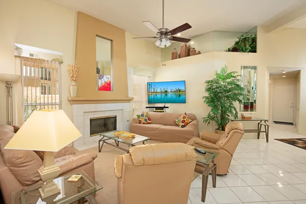 a living room with furniture and a fireplace