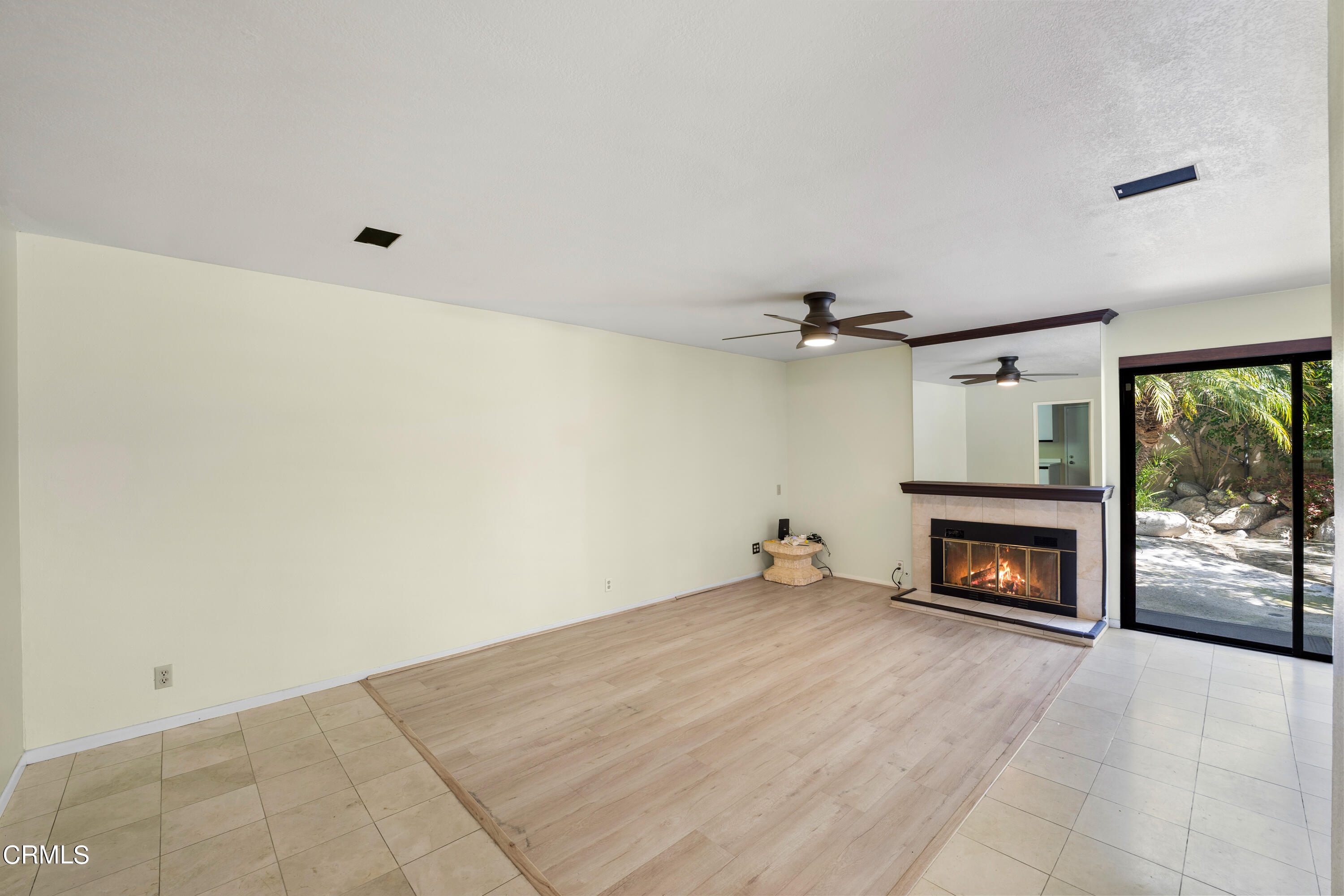 2210 Lyndhurst Avenue Camarillo, CA 93010 - Photo 14 of 37 an empty room with fireplace and windows