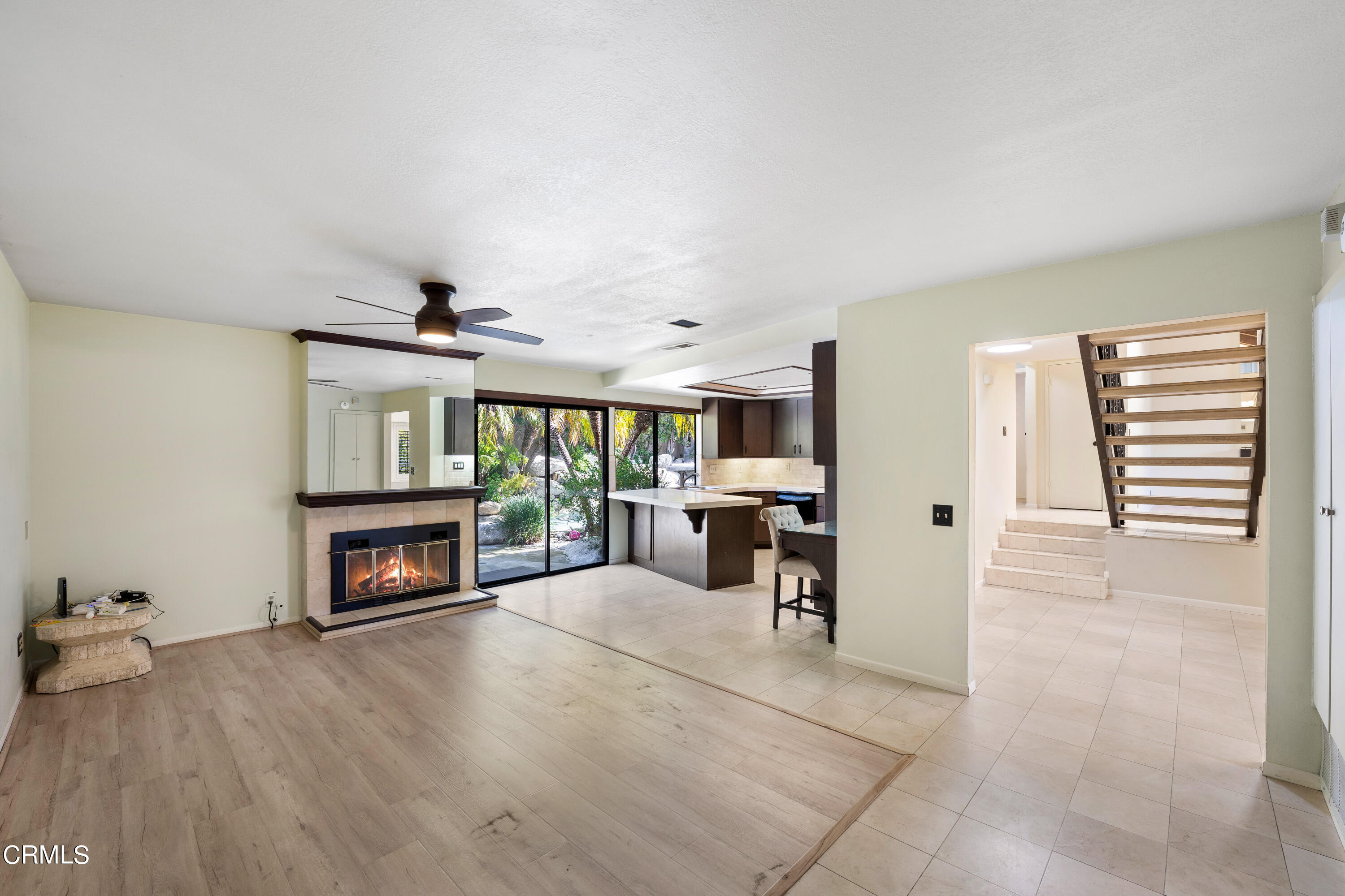 2210 Lyndhurst Avenue Camarillo, CA 93010 - Photo 15 of 37 a living room with furniture a fireplace and a flat screen tv