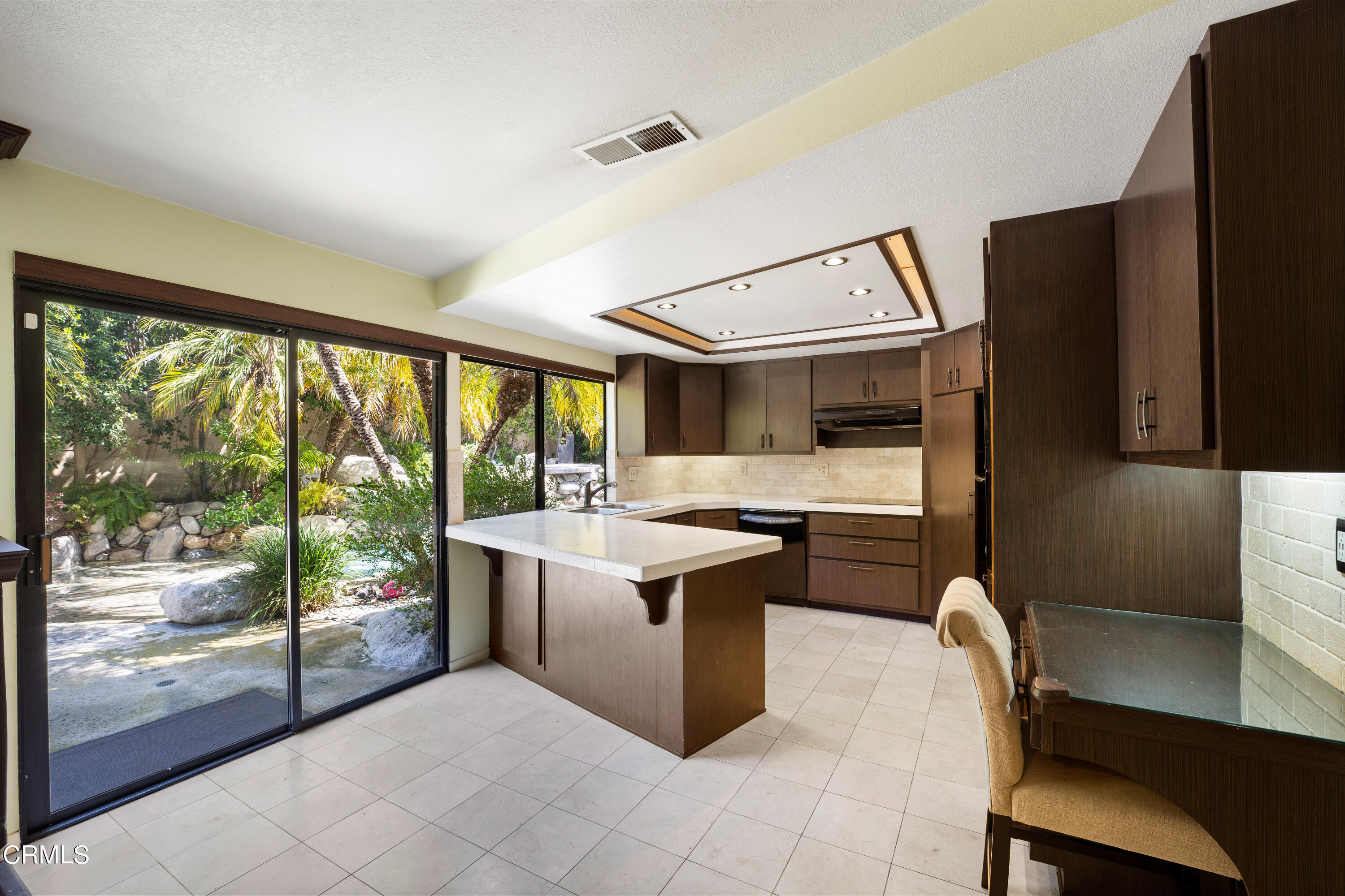 2210 Lyndhurst Avenue Camarillo, CA 93010 - Photo 17 of 37 a kitchen with a stove a refrigerator and wooden floor