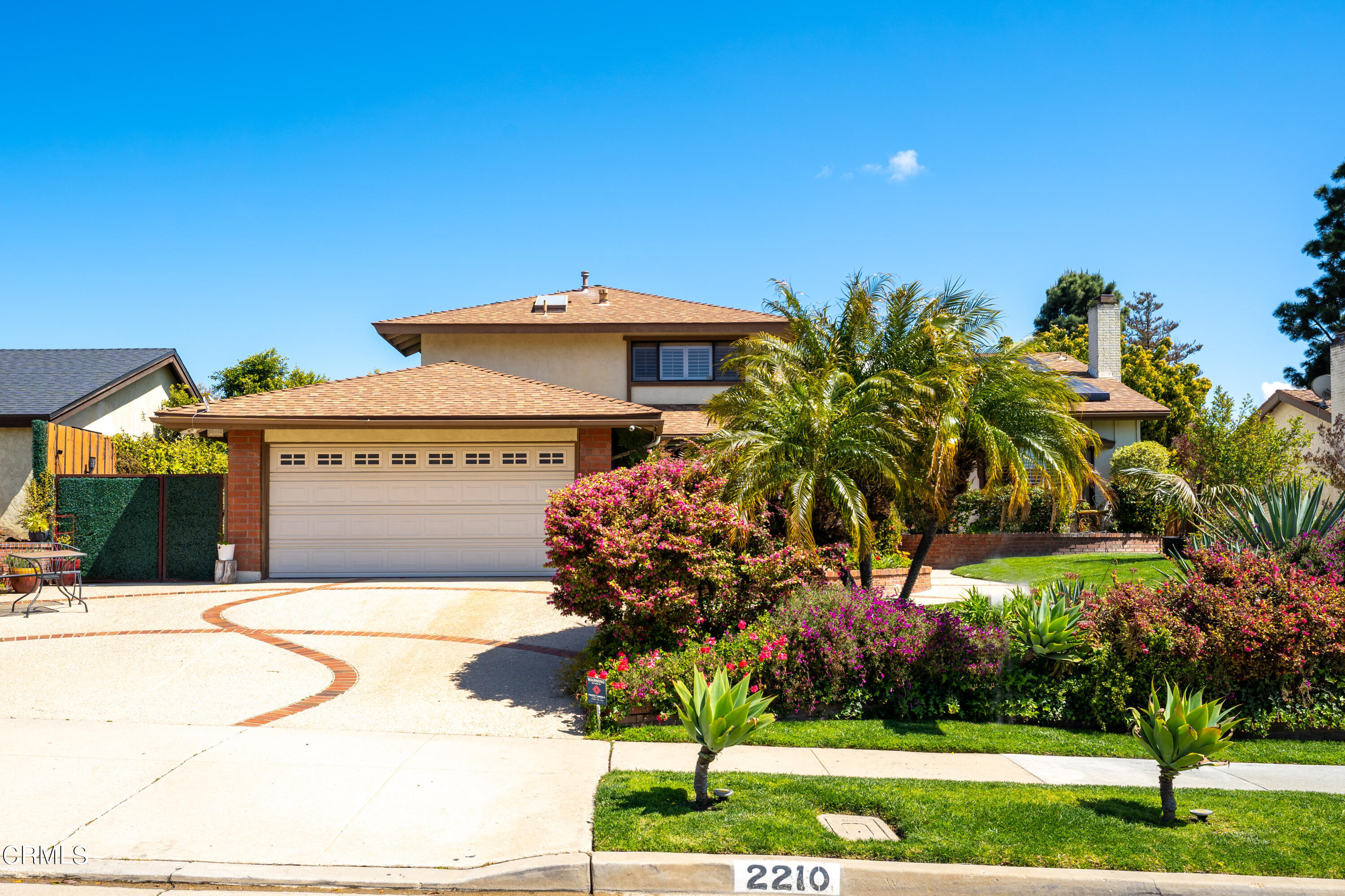 2210 Lyndhurst Avenue Camarillo, CA 93010 - Photo 2 of 37 a front view of a house with a yard