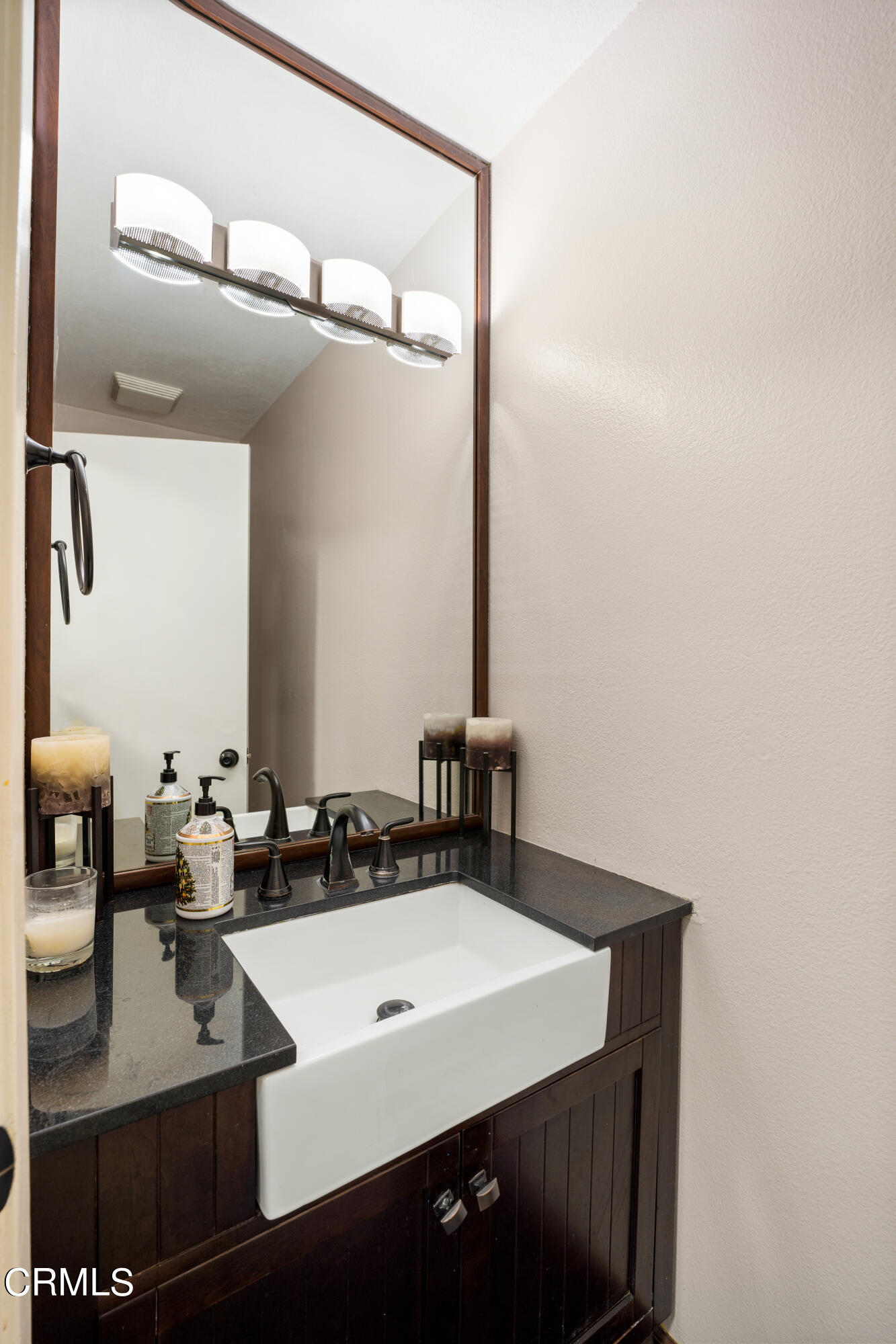 2210 Lyndhurst Avenue Camarillo, CA 93010 - Photo 22 of 37 a bathroom with a sink vanity and a mirror