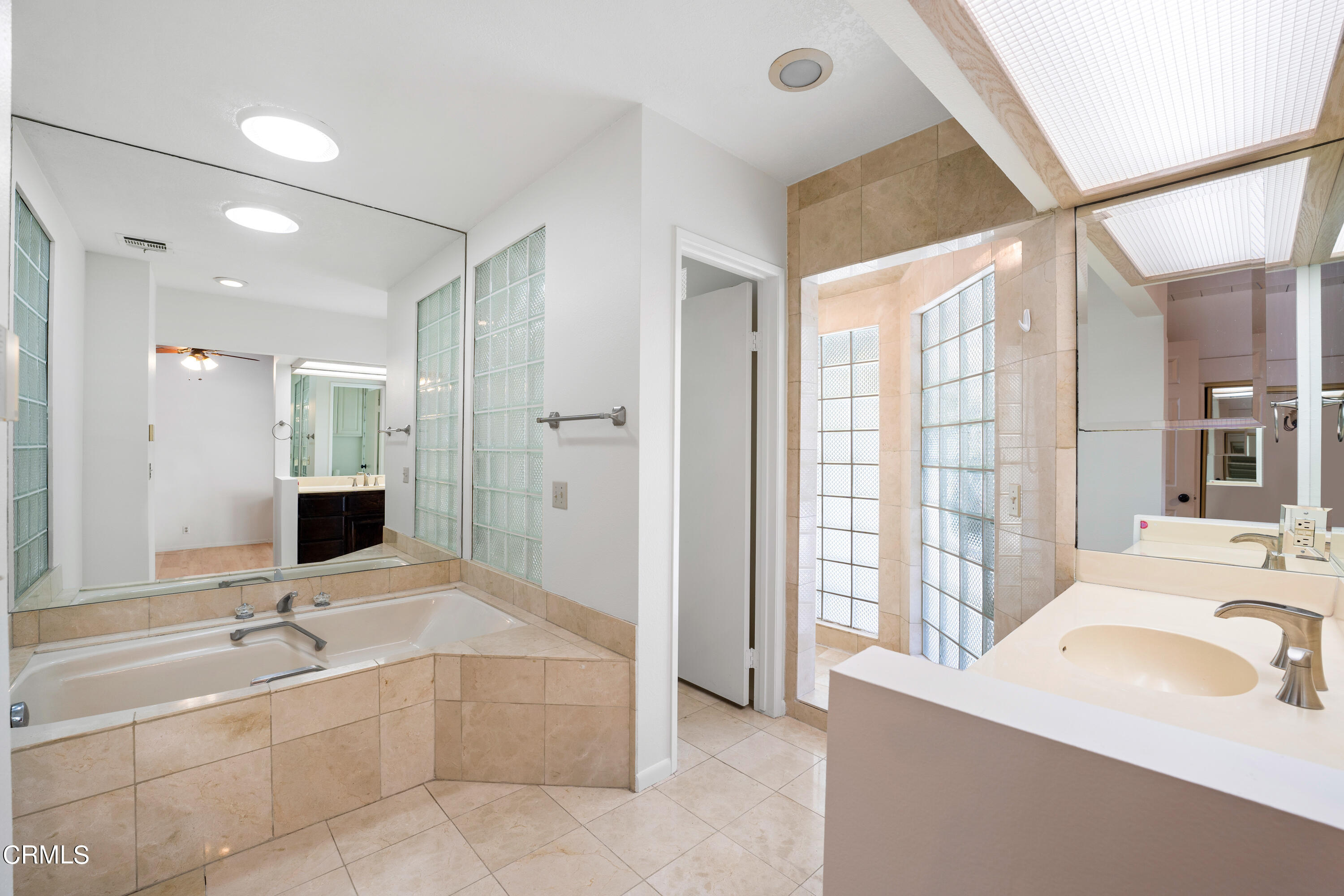 2210 Lyndhurst Avenue Camarillo, CA 93010 - Photo 25 of 37 a spacious bathroom with a tub sink and mirror