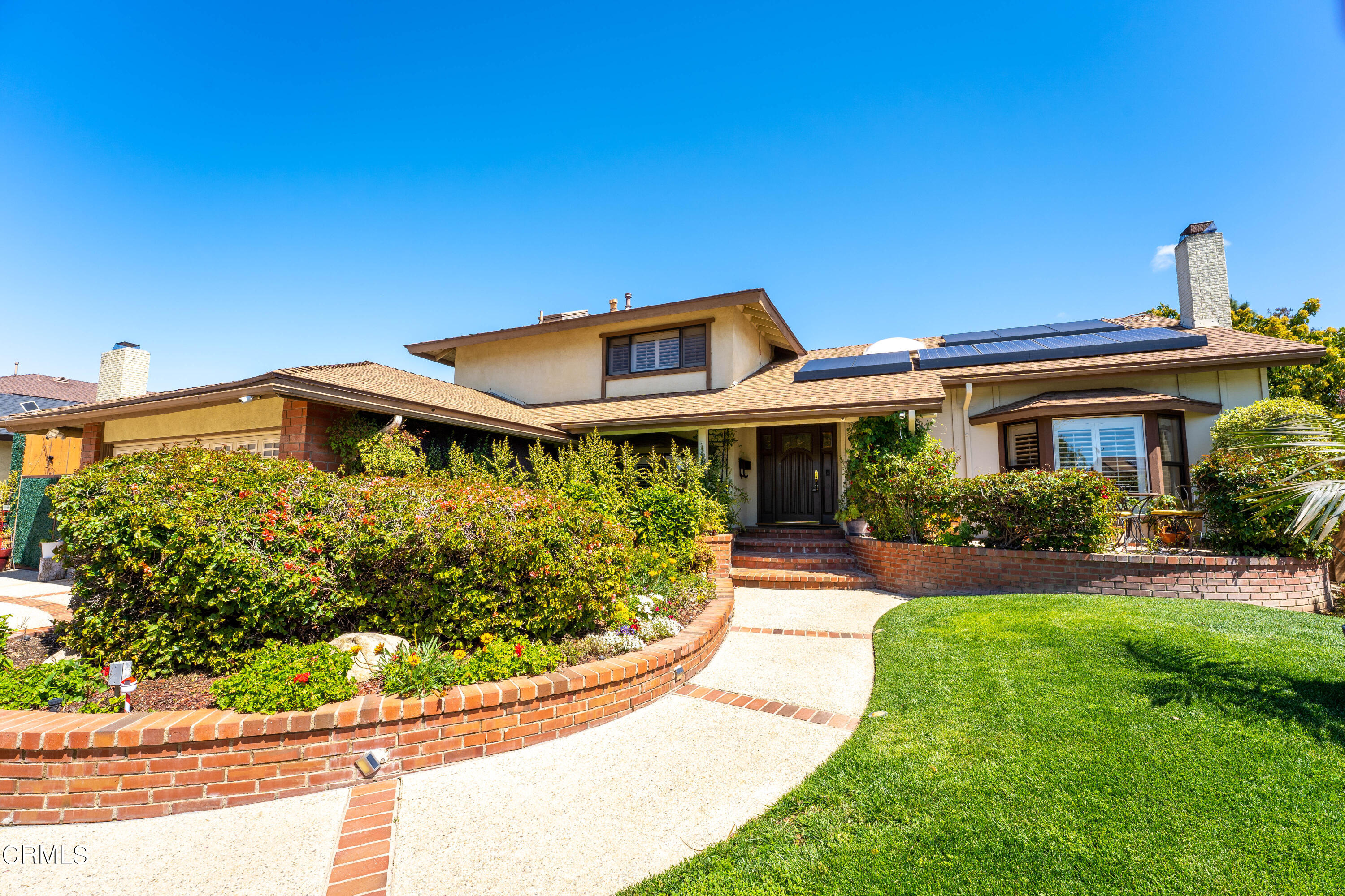 2210 Lyndhurst Avenue Camarillo, CA 93010 - Photo 4 of 37 a front view of a house with a yard