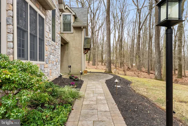 a big room with wooden floor and windows