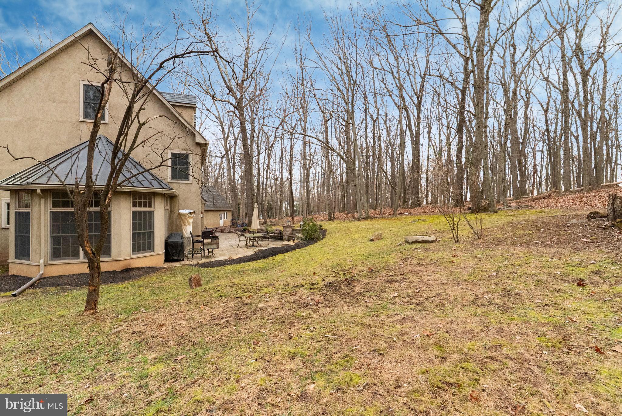 7044 Ely Road New Hope, PA 18938 - Photo 53 of 61 a backyard of a house with lots of green space and fountain