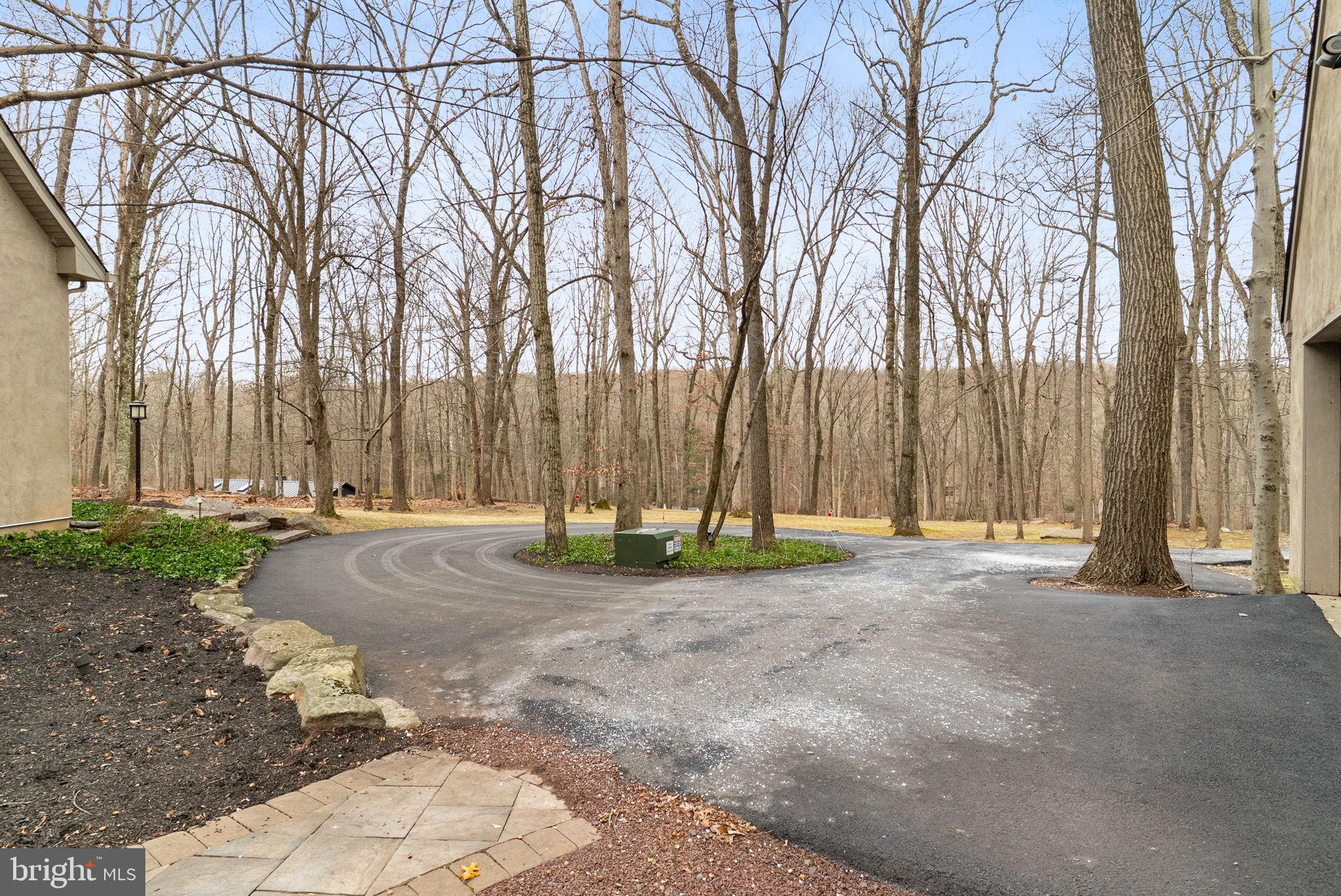 7044 Ely Road New Hope, PA 18938 - Photo 56 of 61 a view of a backyard with large trees